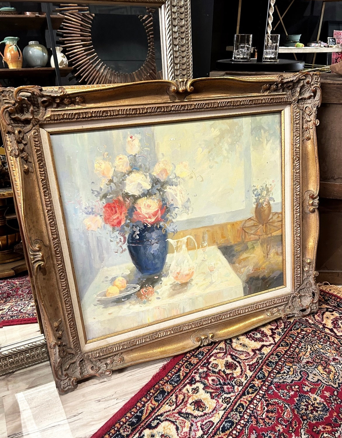 large floral still life with ornate frame