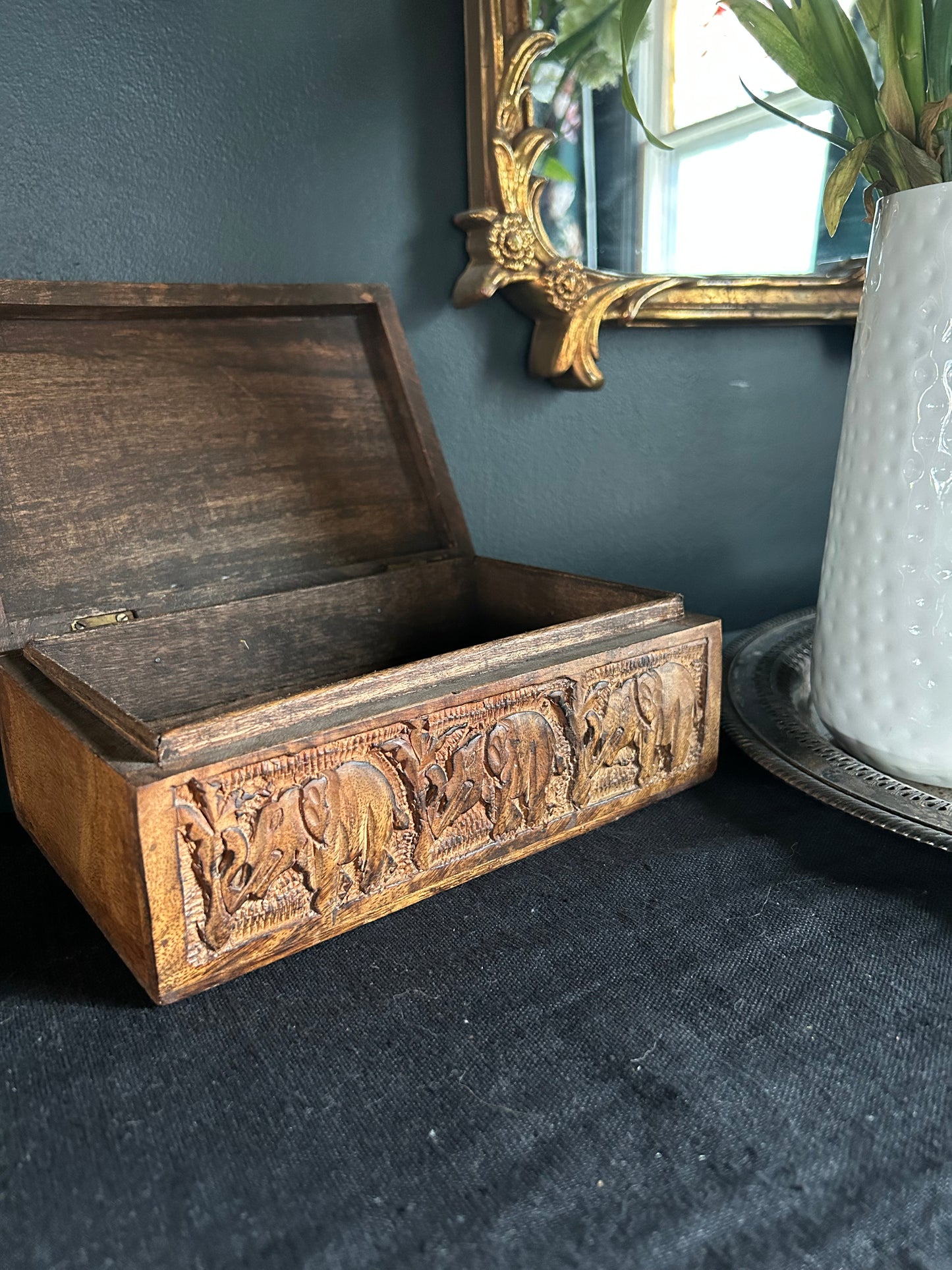 medium-toned hand-carved wooden box